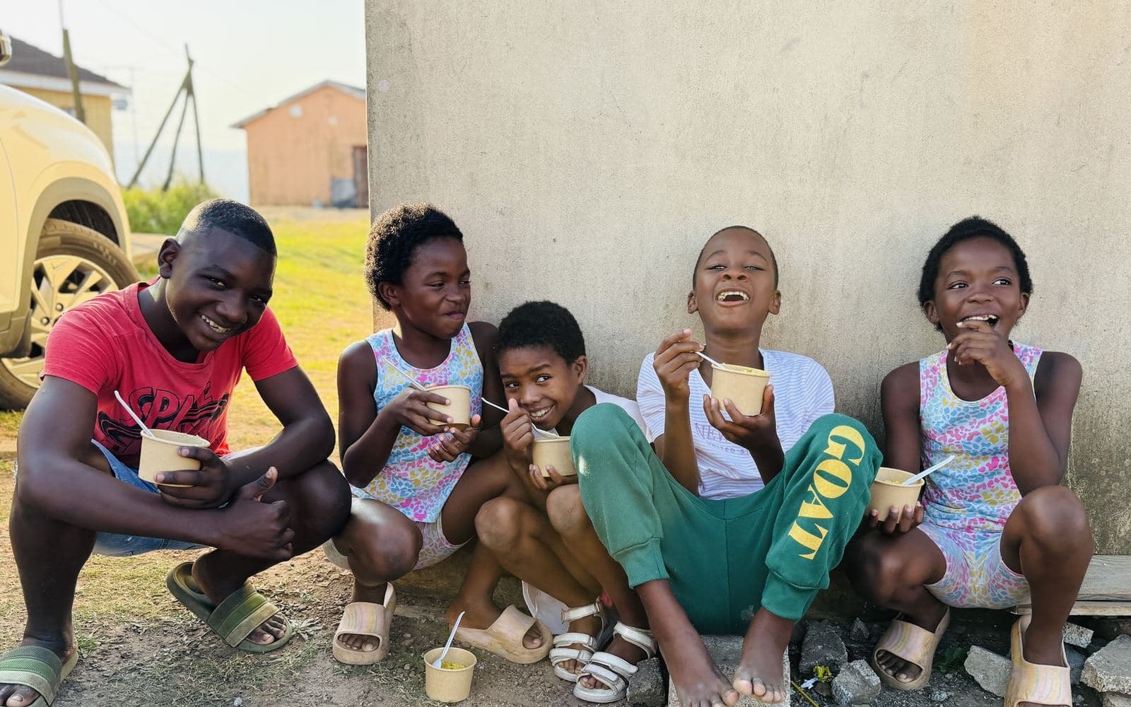 Children smiling as they enjoy a Big Five Foods meal
